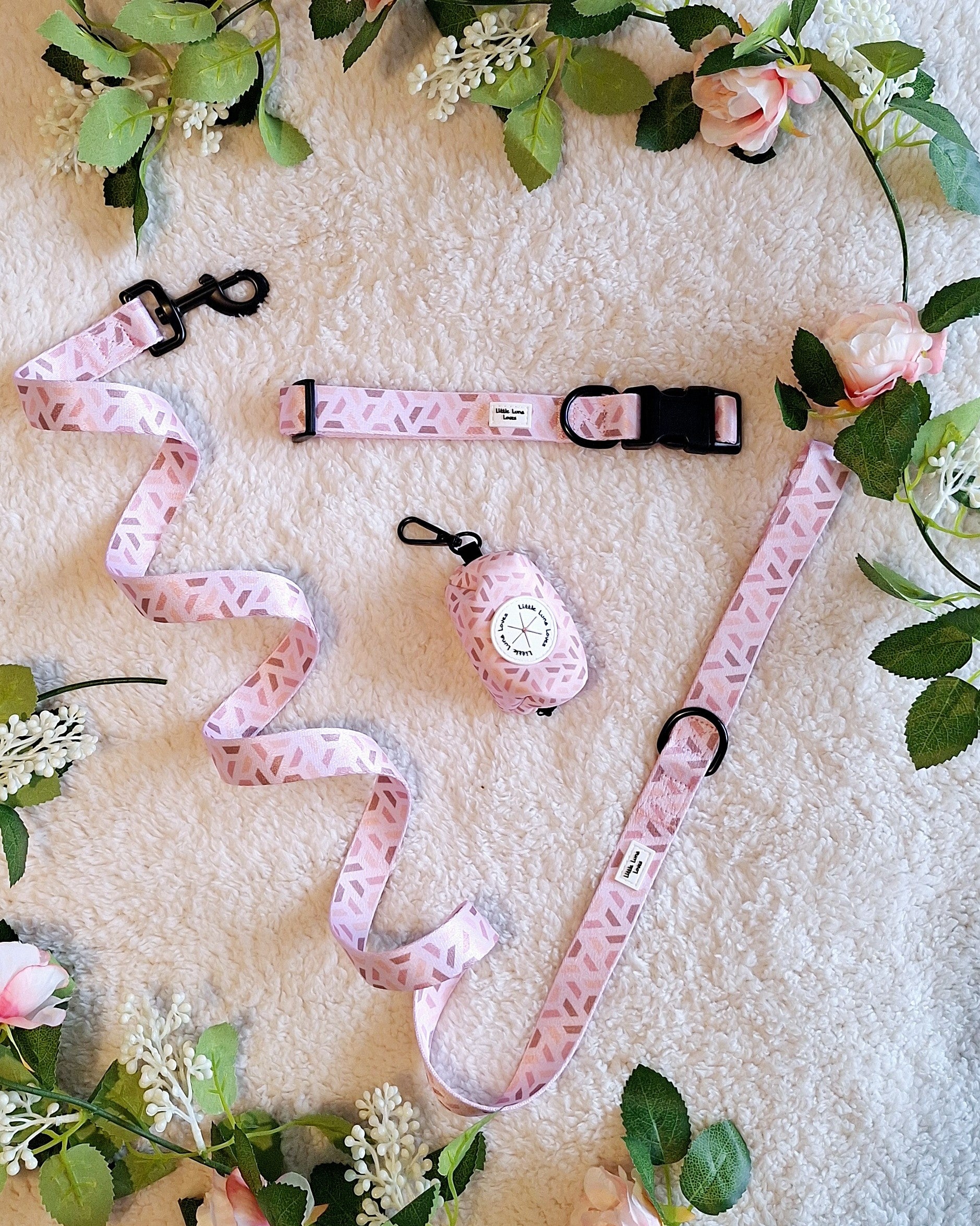 a matching pink dog lead, collar and poop bag holder