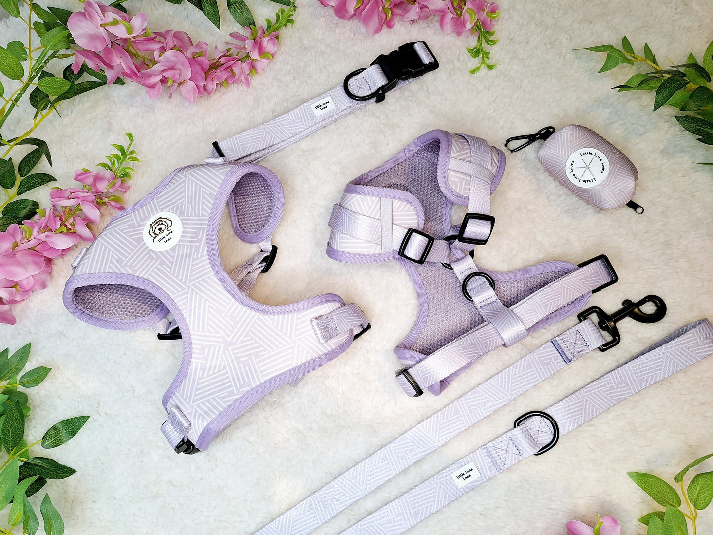 Adjustable purple dog harness with matching collar, lead and poop bag holder