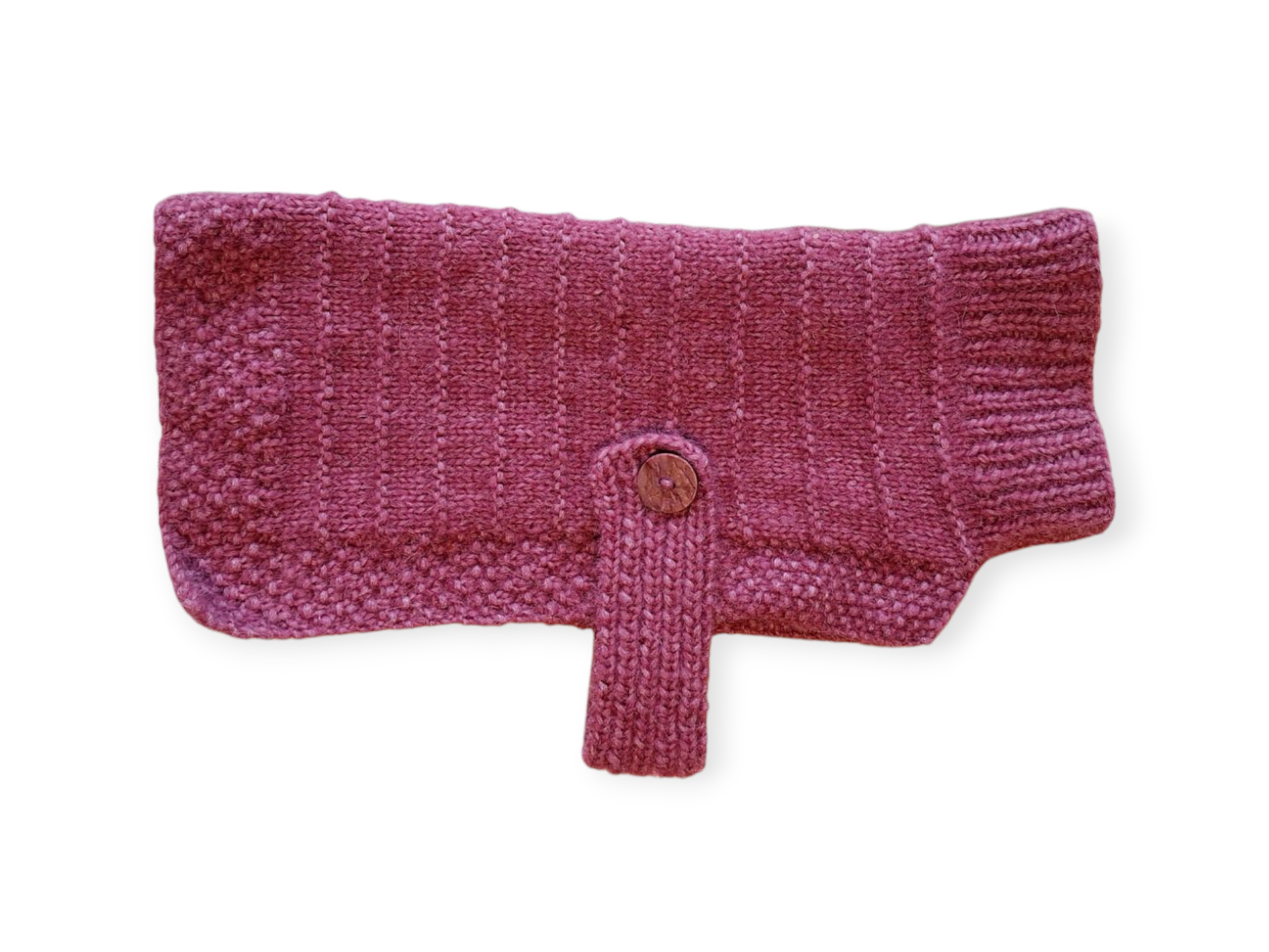 a pink knitted dog jumper on a white background