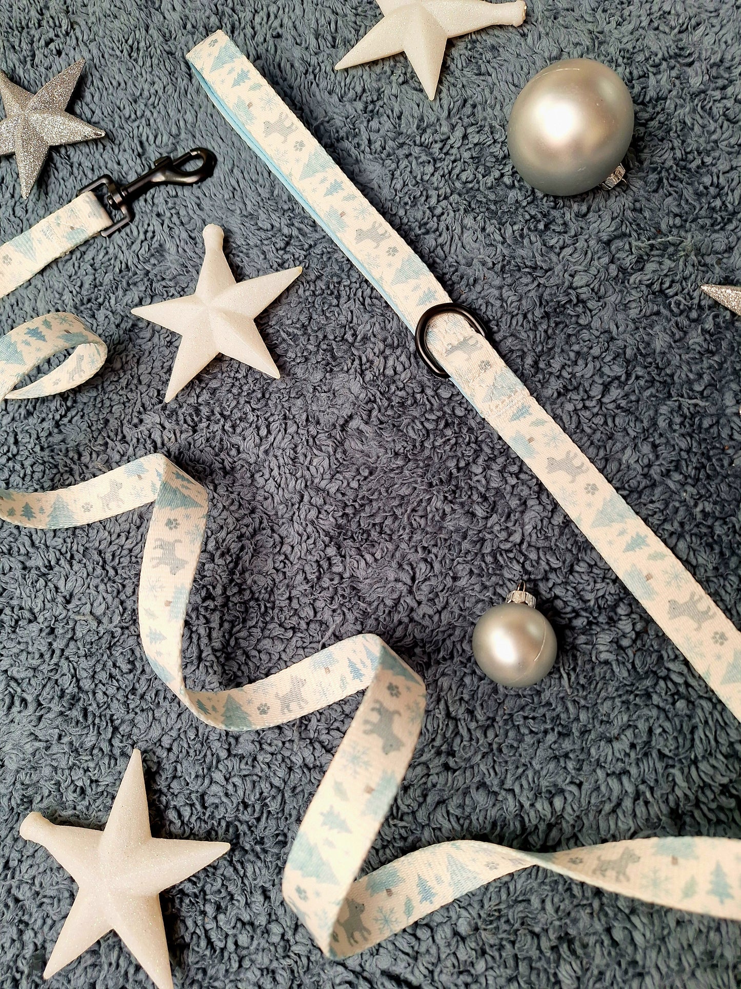 Decorative ribbon with stars and ornaments on a textured surface