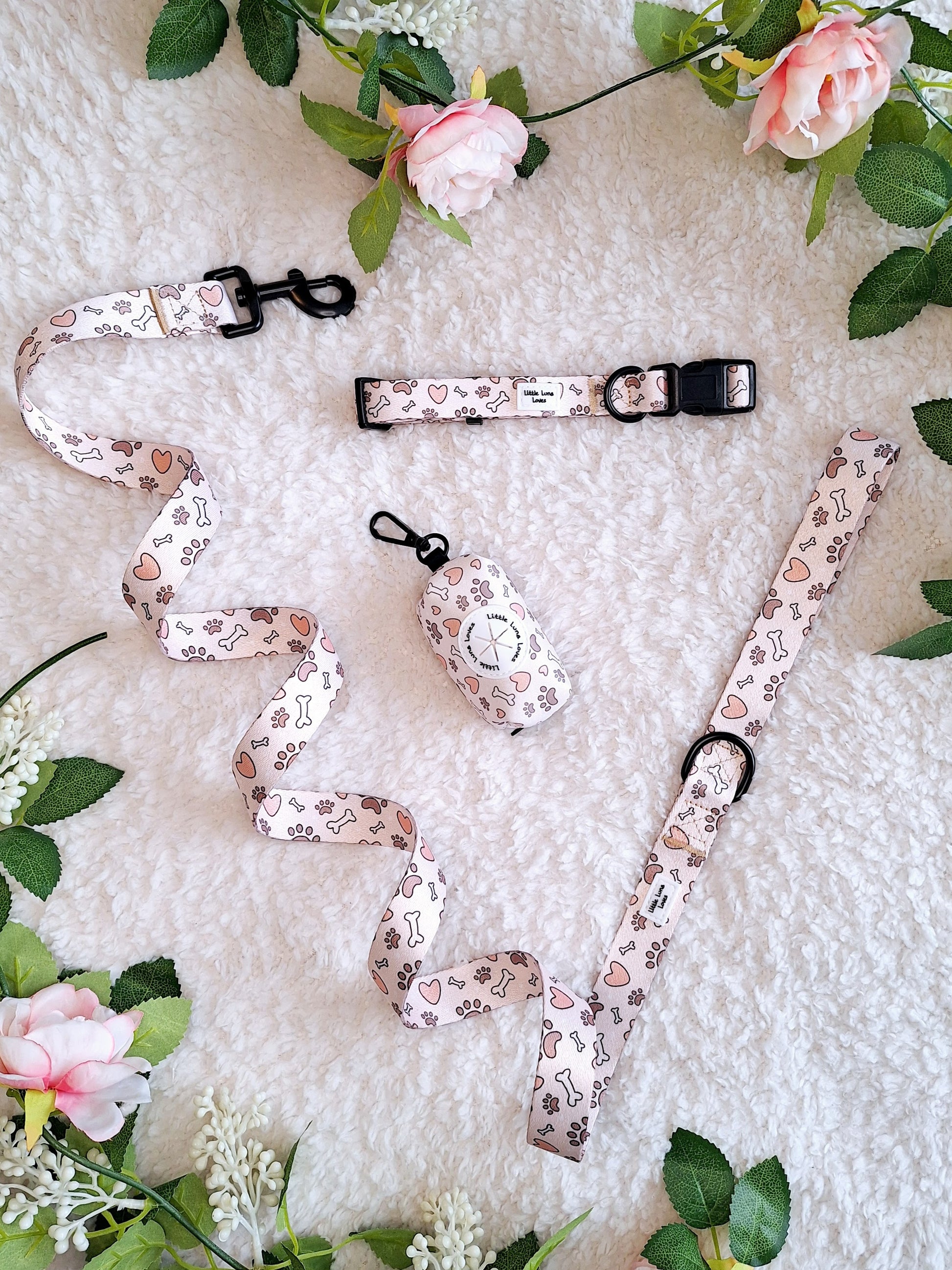dog lead, collar and poop bag holder in a stylish bone, paw and heart design