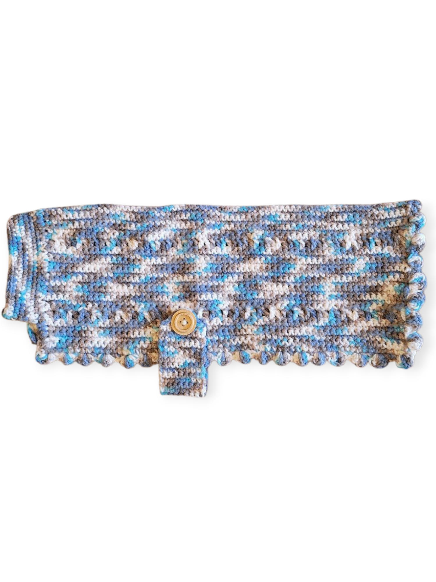 A hand knitted wool dog jumper with a blue, white, and grey pattern. It appears to be laid flat for the photo.