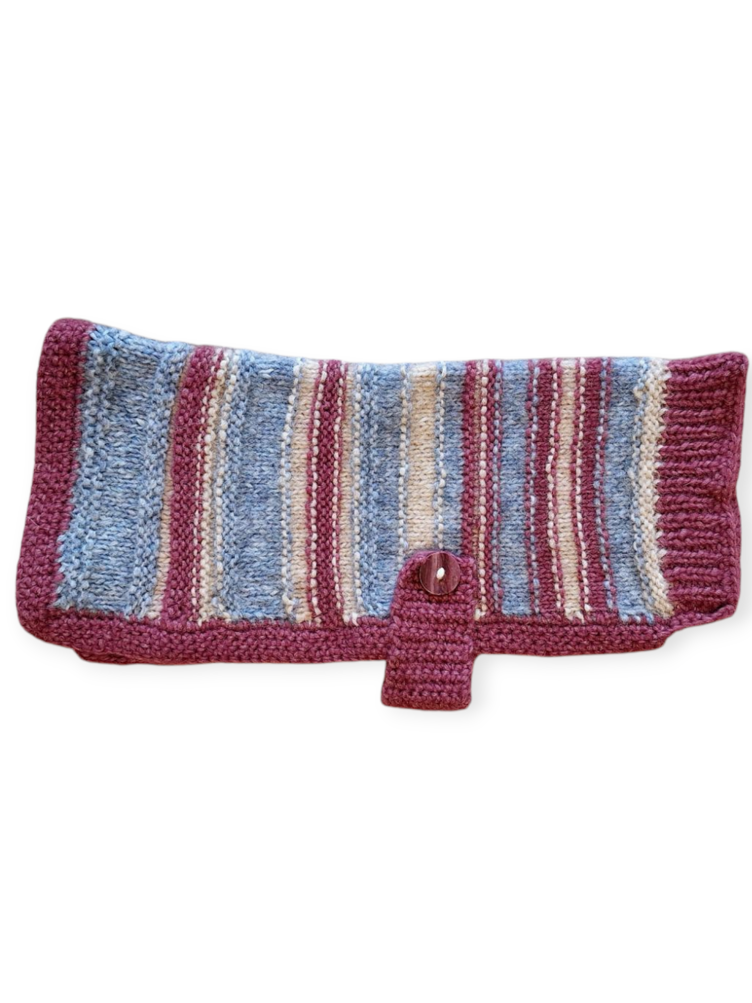 A hand knitted dog jumper with pink, blue, and cream stripes. The waist size is 38cm, and the back length is 34cm.