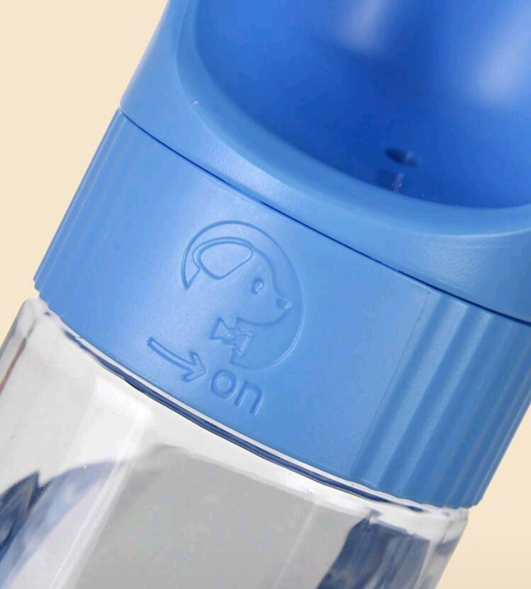 Blue pet water bottle with clear container on a beige background