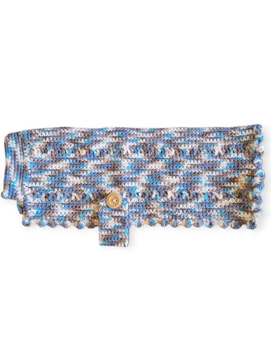 A hand knitted wool dog jumper with a blue, white, and grey pattern. It appears to be laid flat for the photo.