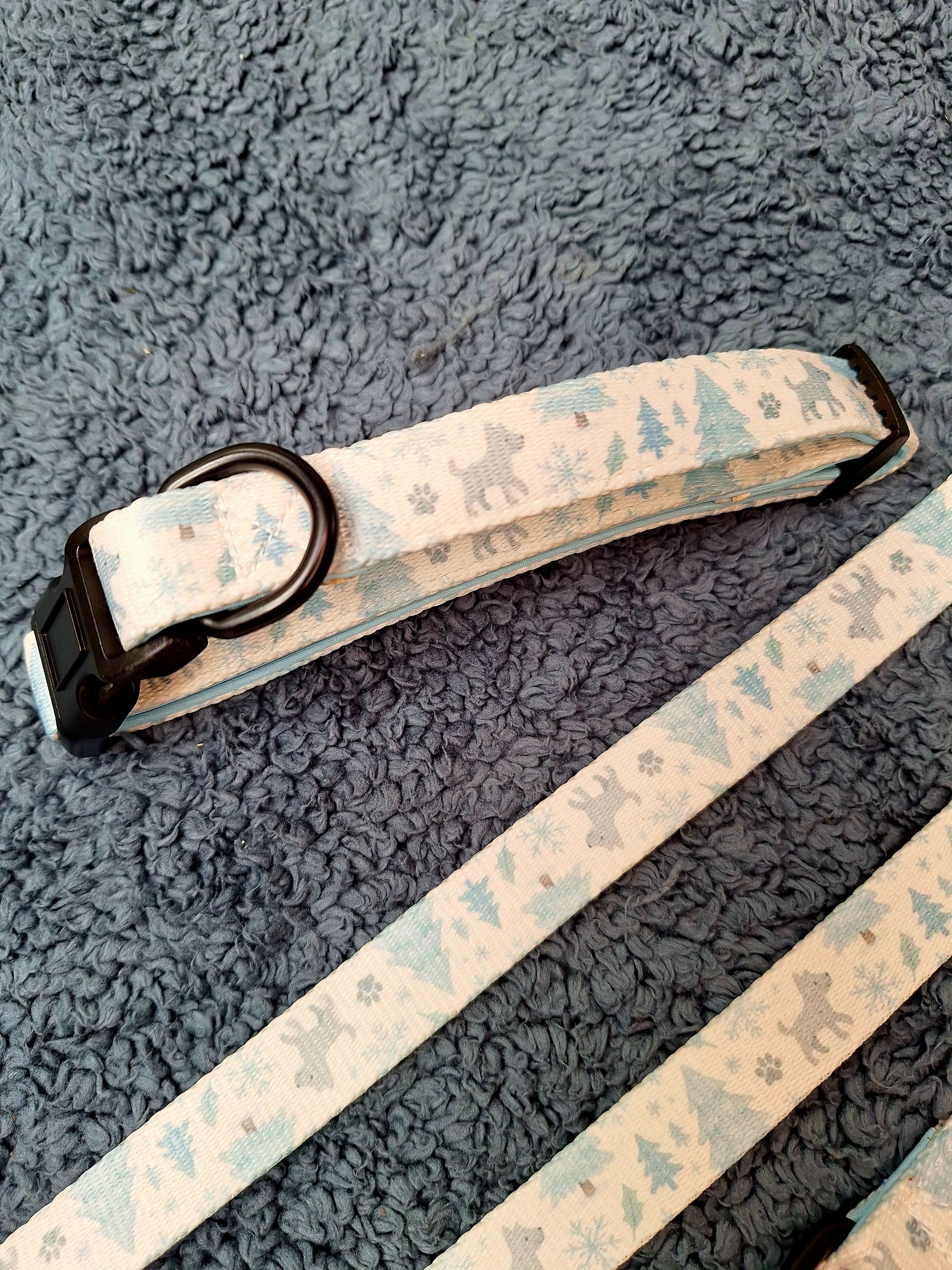 Dog collar with nature-themed print on a textured gray surface