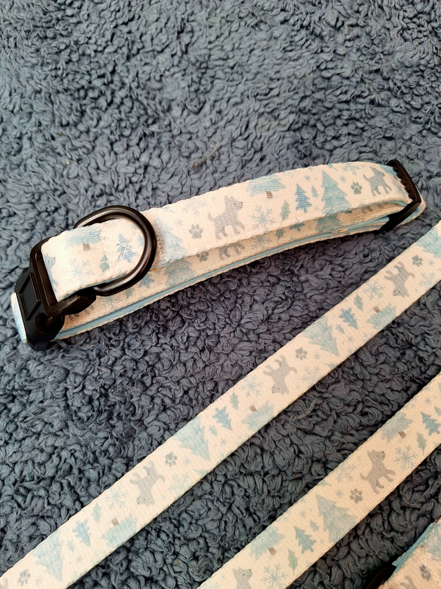 Dog collar with nature-themed print on a textured gray surface